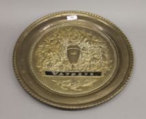 A Watneys Beer brass wall plaque. 42 cm diameter.