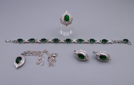 A matching suite of silver and cubic zirconia jewellery, including: a bracelet, a ring,