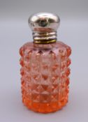 A silver topped glass perfume bottle. 4.5 cm high.