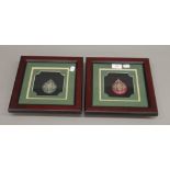 Two framed Chinese pendants.