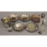A silver ashtray, silver salts, a silver shell butter dish, etc. 3.