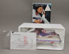 An Overton's boxed novelty jet ski telephone.