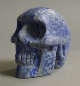 A lapiz model of a skull. 6.5 cm high.