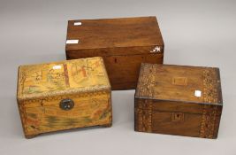 Three antique wooden boxes.