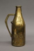 A WMF Art Nouveau brass bottle holder. 29 cm high.