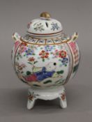 A Chinese famille rose censer hand painted with figures and flowers. 16 cm high.