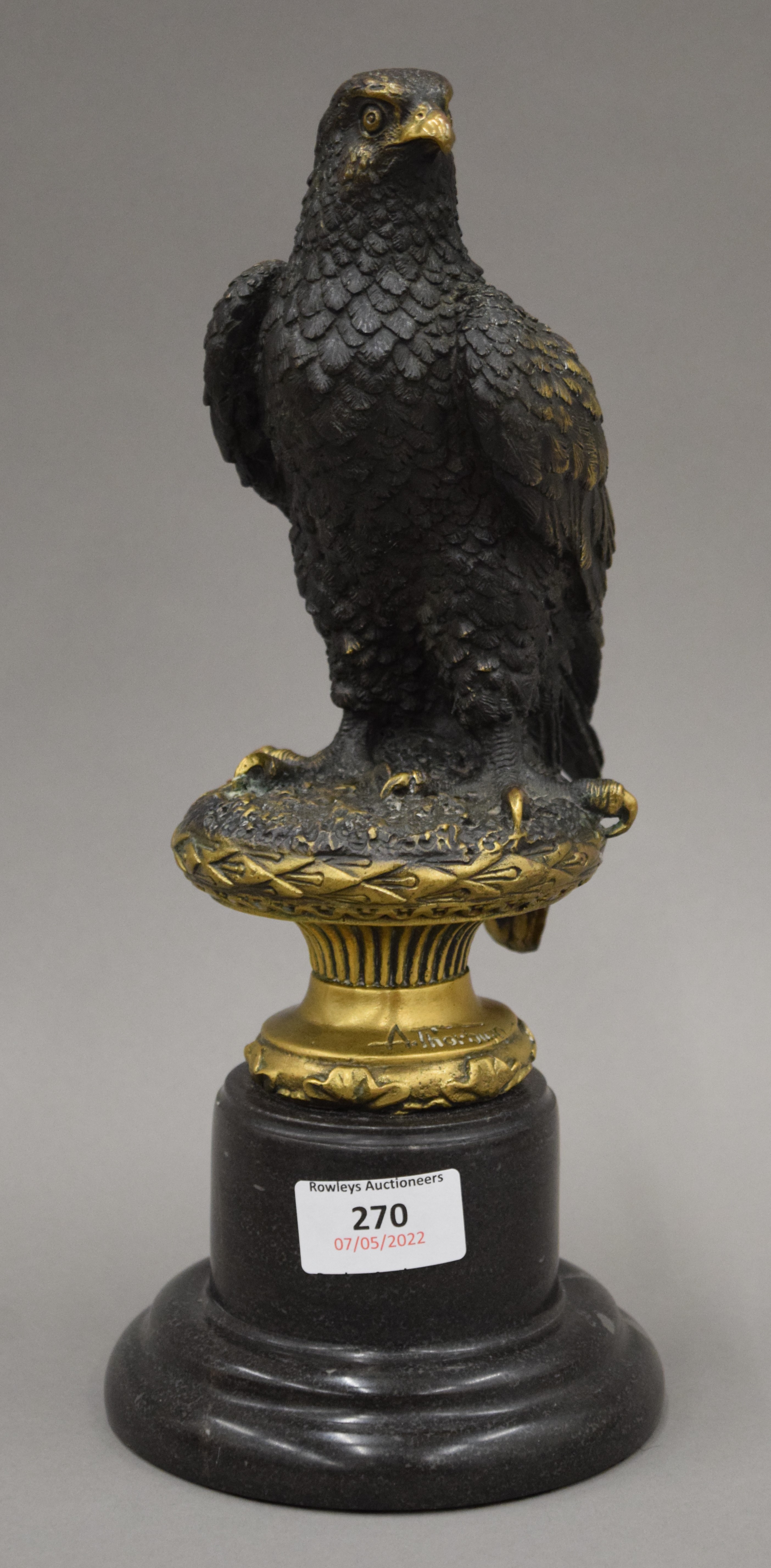 After ARCHIBALD THORBURN (1860-1935), a bronze model of an eagle, set on a marble base,