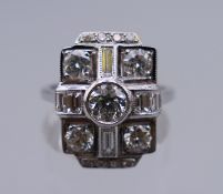 An 18 ct white gold Art Deco style diamond ring, approximately 2 carats of diamonds. Ring size O.