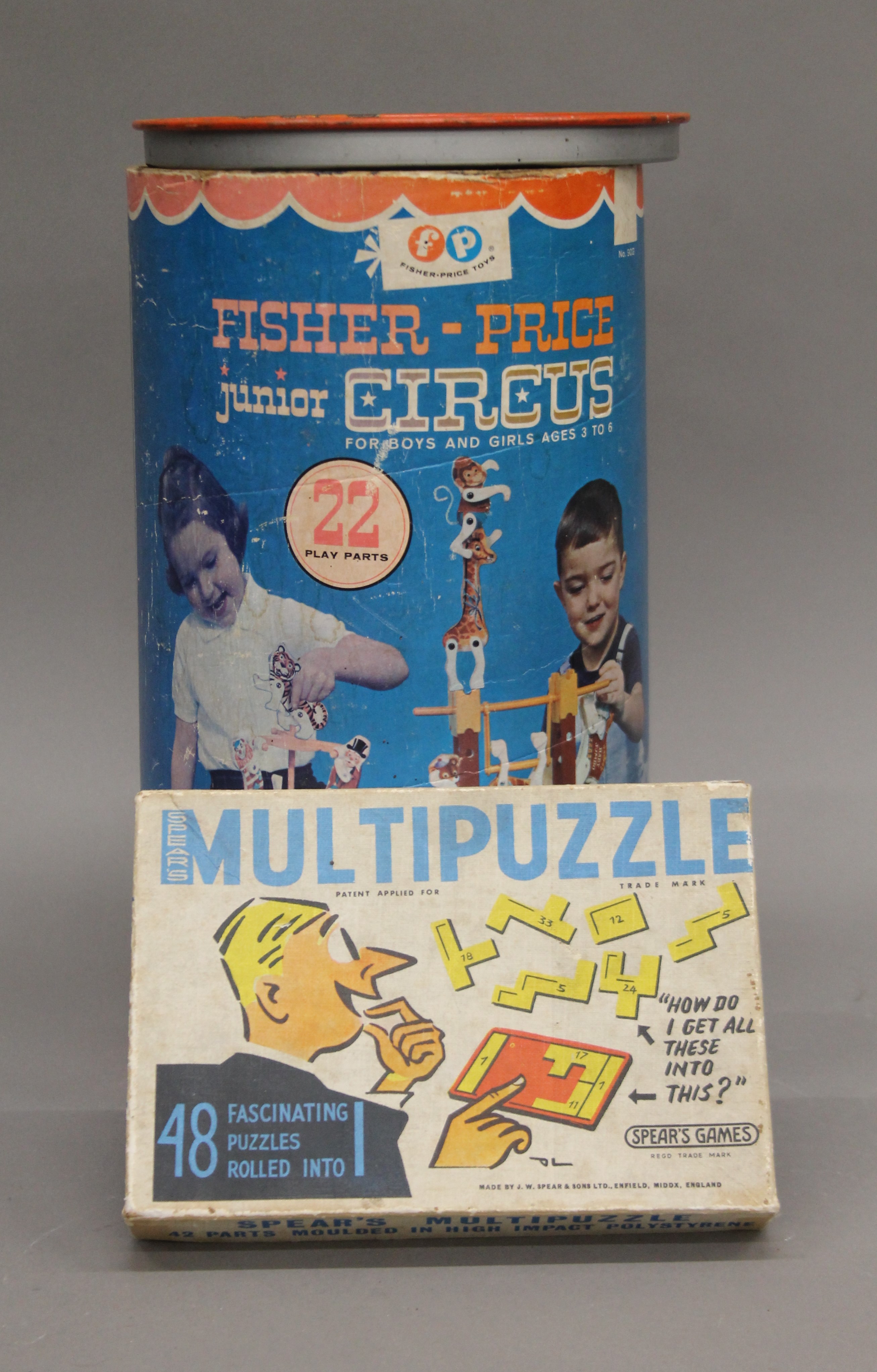 A boxed Fisher Price Junior Circus and a puzzle.