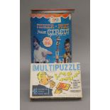 A boxed Fisher Price Junior Circus and a puzzle.