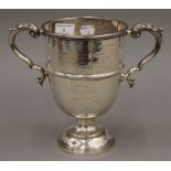 A twin handled silver cup for The Essex Farmers Hunt Steeple Chases. 21 cm high. 17.5 troy ounces.