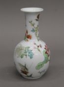 A Chinese famille rose vase hand painted with flowers, butterflies, dragonfly, etc.