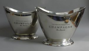 A pair of oval champagne coolers.