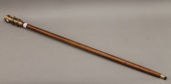 A walking stick, the handle formed as a telescope and a compass. 99 cm high.