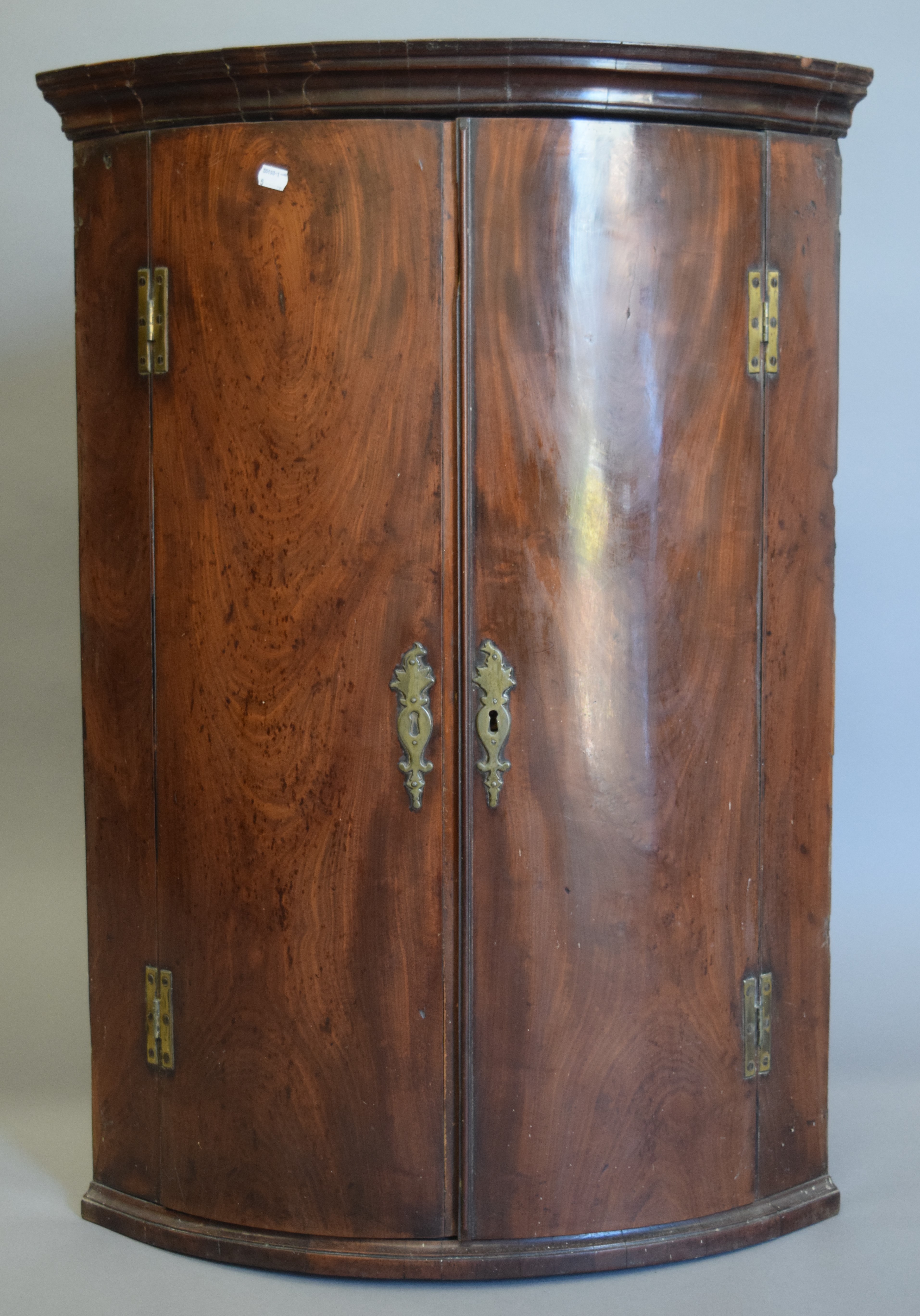 A George III mahogany corner cupboard. 71.5 cm wide.