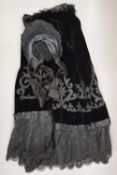 A Victorian lace and velvet skirt and bonnet.