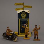 A four-piece Dinky AA set, comprising of a kiosk, a motorbike and sidecar,