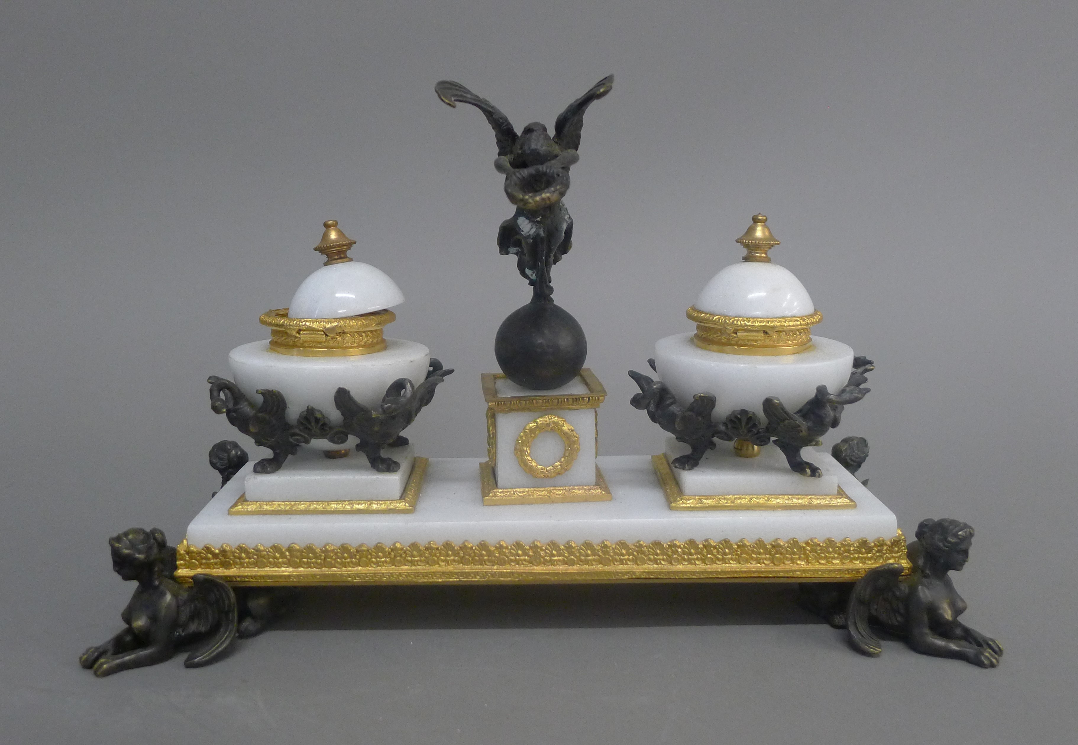 A gilt and patinated bronze mounted desk stand. 28.5 cm wide.