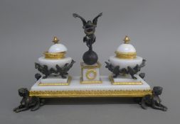 A gilt and patinated bronze mounted desk stand. 28.5 cm wide.