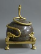 A gilt bronze and marble model of a snake and ball. 28 cm high.