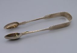 A pair of silver sugar nips/tongs. 14.5 cm long. 48.6 grammes.