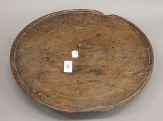 An Eastern turned wooden stand. 38.5 cm diameter.