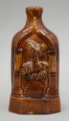 A Victorian treacle glazed stoneware bottle depicting Queen Victoria. 19 cm high.