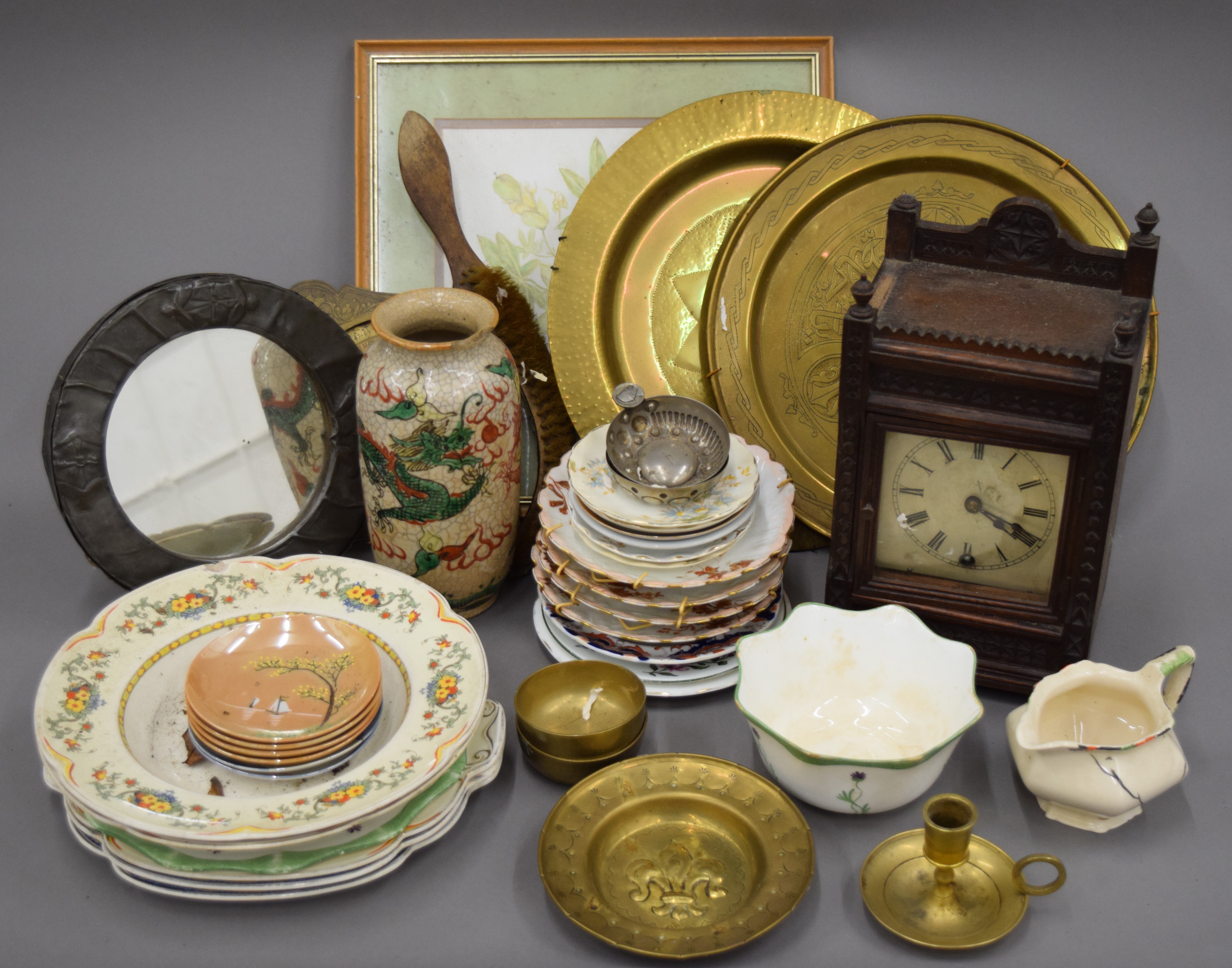 A quantity of miscellaneous items, including porcelain, pewter mirror, a mantle clock, etc.