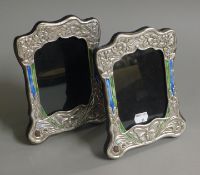 A pair of silver Art Nouveau style photograph frames. 21 cm high.