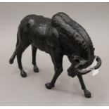 A leather model of a wildebeest. 31 cm long.