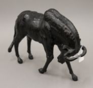 A leather model of a wildebeest. 31 cm long.