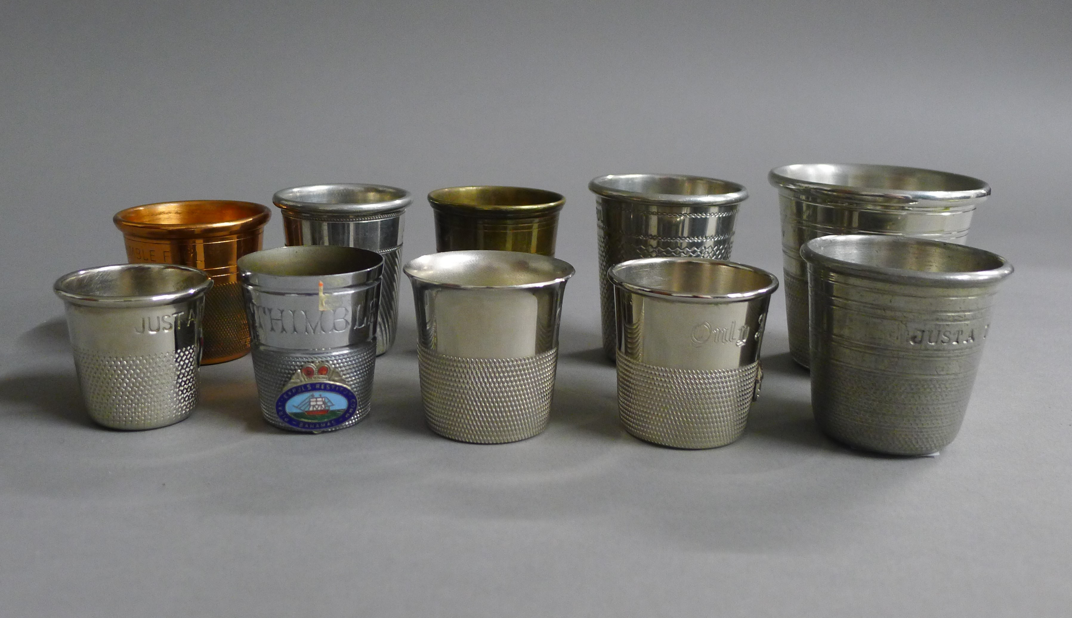 A quantity of thimble form shot cups.