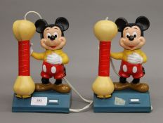 Two Mickey Mouse novelty telephones.