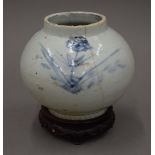 A Korean blue and white porcelain vase of compressed globular form,