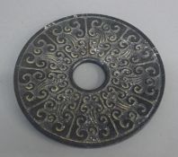 A Chinese bi-disc. 15 cm diameter.