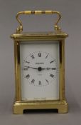 A brass carriage clock. 14 cm high overall.