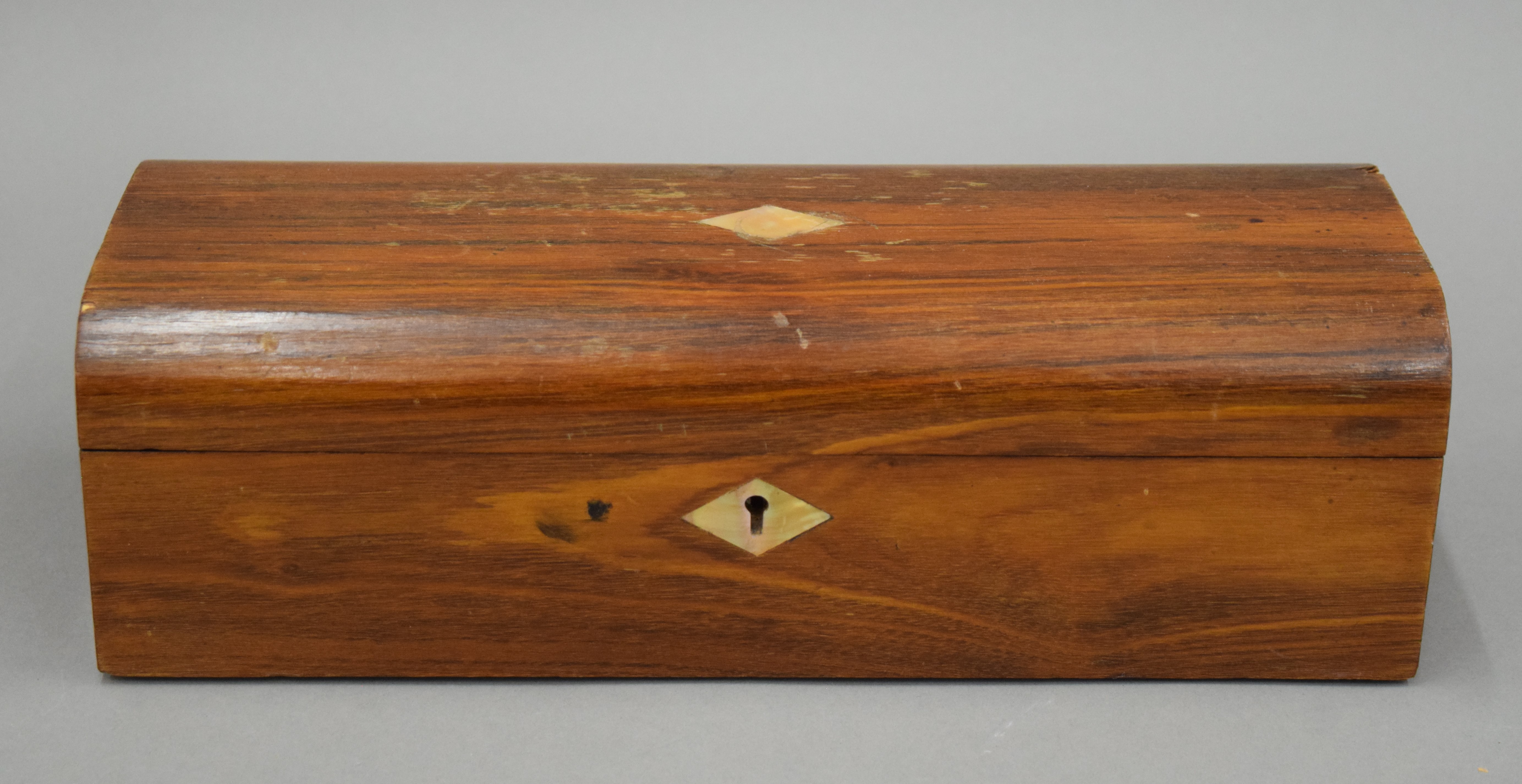 A Victorian walnut glove box. 29 cm long.