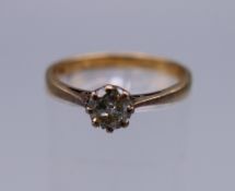 A 9 ct gold diamond solitaire ring. Diamond weight 0.25 carat. Ring size M/N. 1.