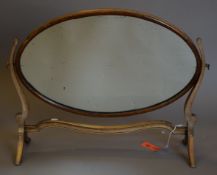 An early 20th century oval framed mahogany dressing table mirror. 71 cm wide.