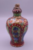 An 18th/19th century Chinese clobbered porcelain snuff bottle. 8 cm high.