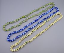 Three Italian strings of glass beads. Each approximately 72 cm long.