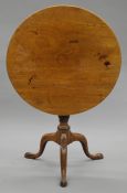 A George III mahogany tilt top tripod table. 70 cm diameter.