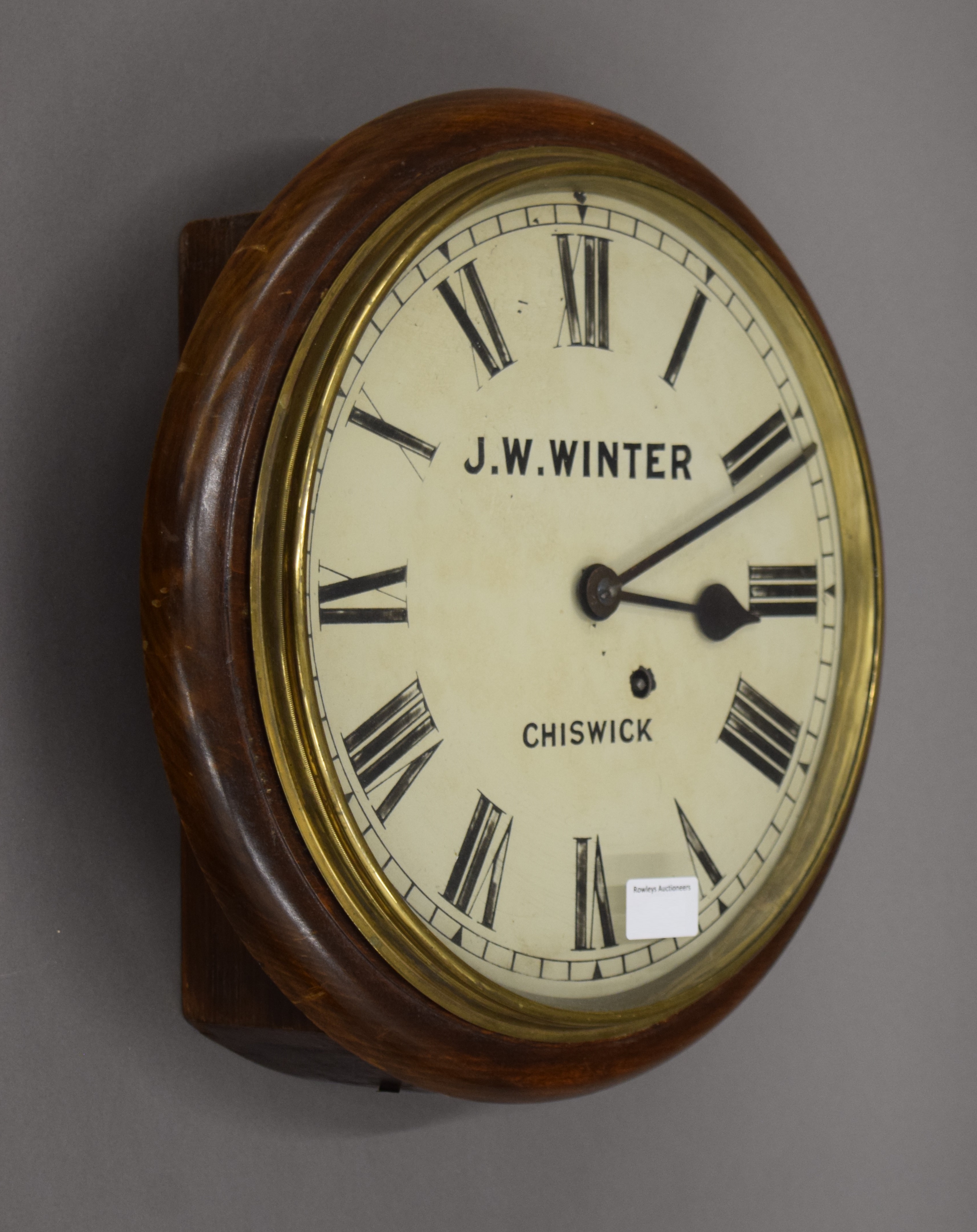 A dial clock, the face inscribed J W Winter, Chiswick. 37 cm diameter.