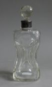 A silver collared hour glass decanter. 19 cm high.