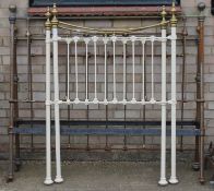 A brass and iron bedstead (lacking side rails),