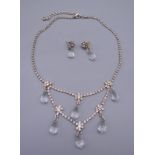 A crystal drop necklace with matching earrings. Necklace 46 cm long, earrings 3 cm high.