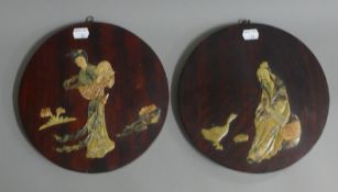 Two Chinese soapstone inset plaques. 24.5 cm diameter.