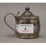 A Georgian silver oval mustard pot, Birmingham 1823. 8 cm high. 4.3 troy ounces.