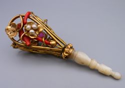 A Victorian coral, pearl, gilt metal and mother-of-pearl posy holder. 12 cm high.