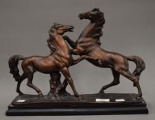 A model of two rearing horses. 40 cm wide.